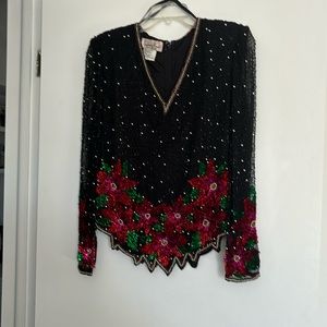 Dressy evening top with shear sleeves.